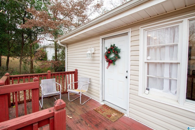 entrance to property with a wooden deck