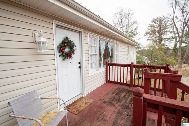 doorway to property featuring a wooden deck