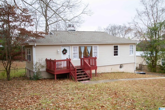 back of house featuring a wooden deck