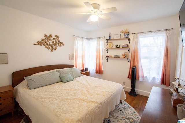 bedroom featuring ceiling fan and dark hardwood / wood-style floors