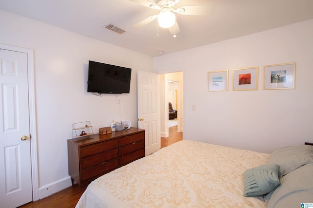 bedroom featuring ceiling fan and dark wood-type flooring