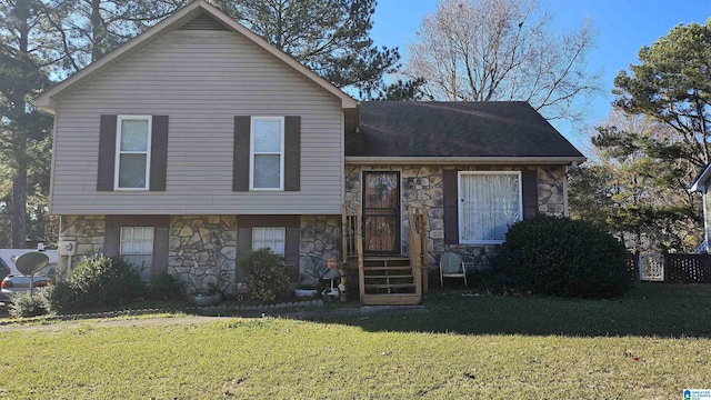 split level home with a front yard