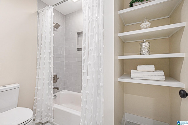 bathroom featuring shower / bath combo and toilet