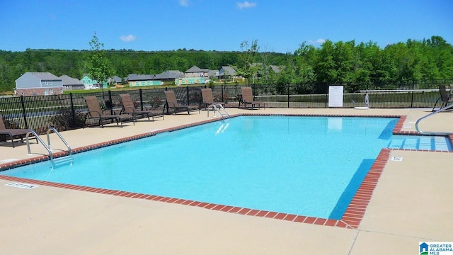 view of pool featuring a patio