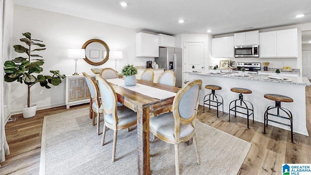 dining room featuring light hardwood / wood-style floors