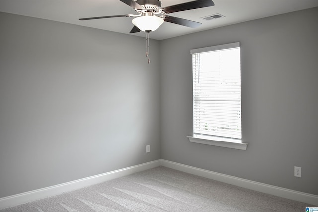 unfurnished room with carpet flooring and ceiling fan