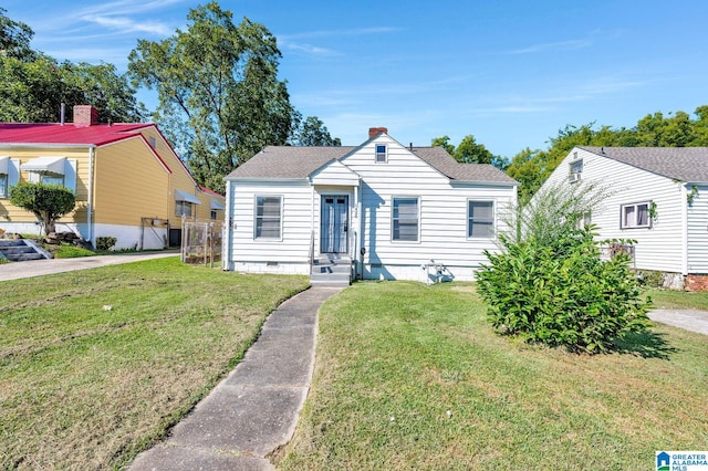 bungalow-style house with a front lawn