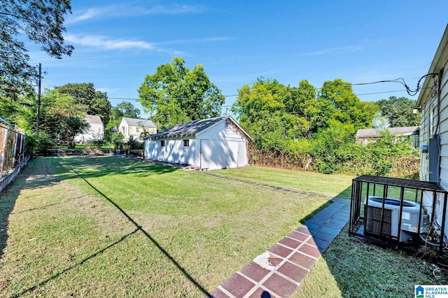 view of yard with an outbuilding and central air condition unit