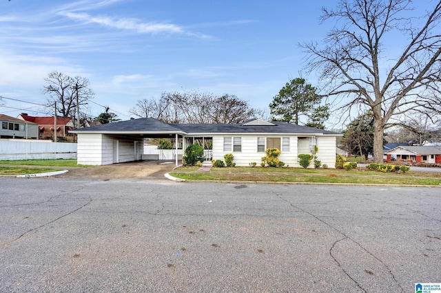 ranch-style house with a carport