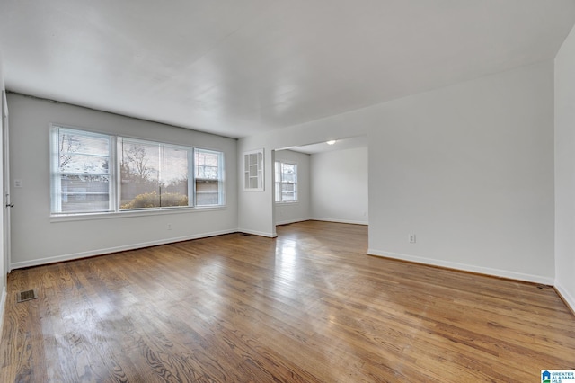 spare room featuring light hardwood / wood-style flooring