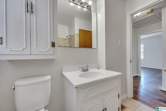 bathroom featuring tile patterned floors, vanity, and toilet