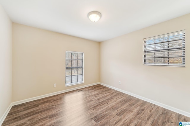 empty room featuring dark hardwood / wood-style floors