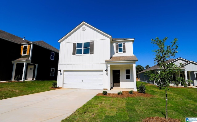 view of front of house with a garage and a front yard