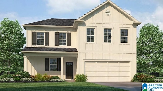 view of front of property featuring a front yard and a garage