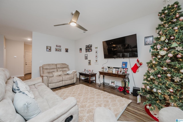 living room featuring hardwood / wood-style flooring and ceiling fan