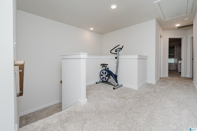 hallway featuring light carpet