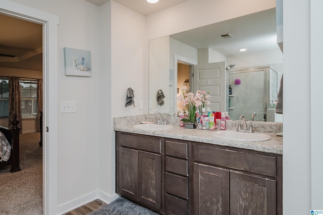 bathroom featuring vanity and walk in shower