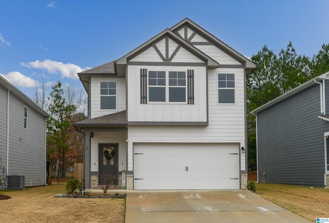 craftsman-style house featuring central AC and a garage