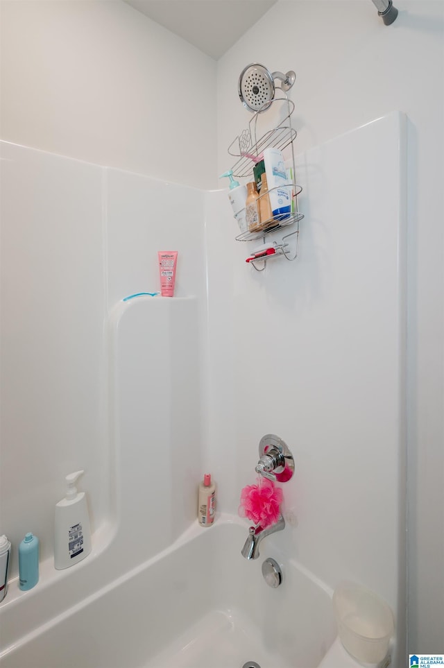 bathroom with shower / washtub combination