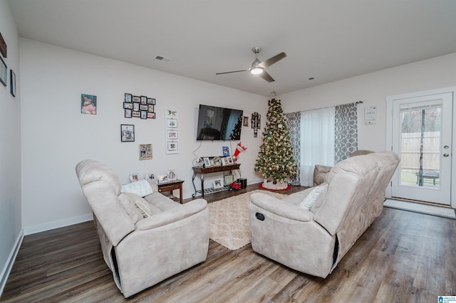 living room with ceiling fan and wood-type flooring