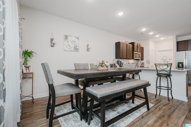 dining room featuring dark hardwood / wood-style flooring