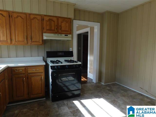 kitchen with white range with gas stovetop