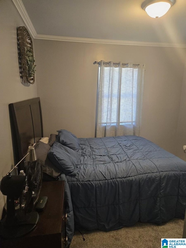 carpeted bedroom with ornamental molding