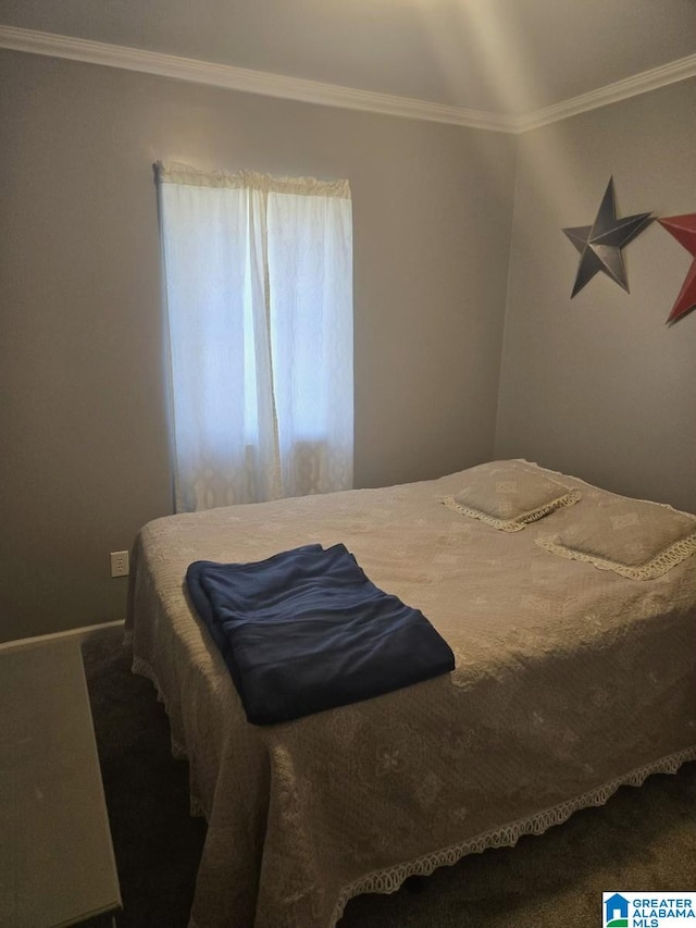 bedroom featuring dark carpet and crown molding