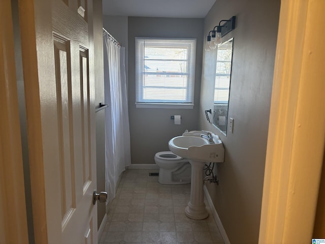 bathroom featuring toilet