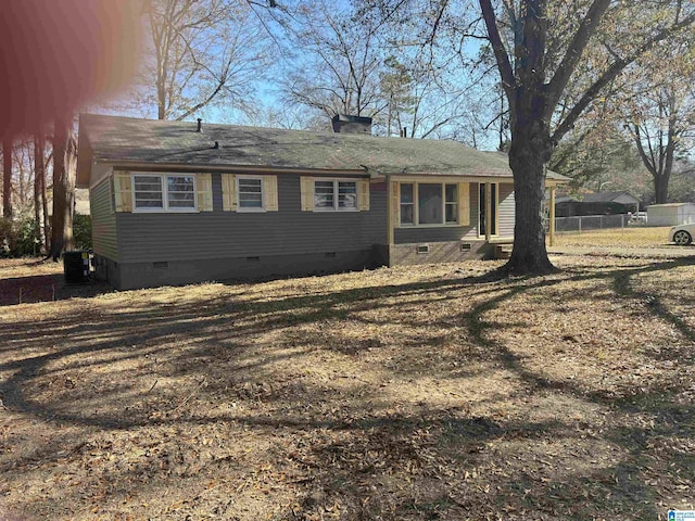 exterior space featuring a lawn and central AC