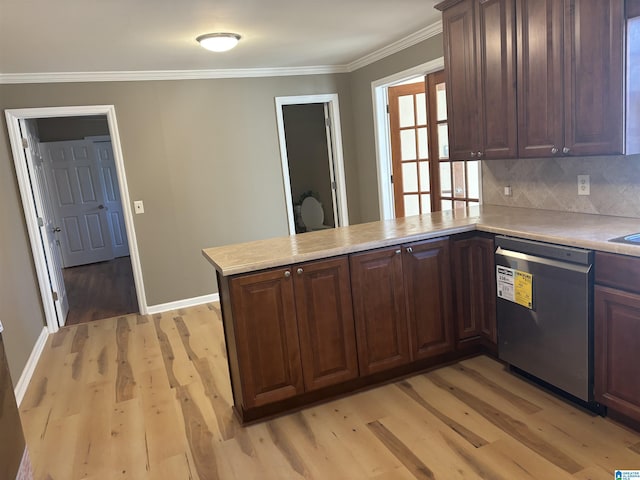 kitchen with kitchen peninsula, decorative backsplash, light wood-type flooring, stainless steel dishwasher, and ornamental molding