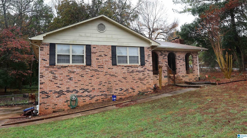 view of home's exterior featuring a yard