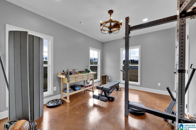 exercise area with an inviting chandelier and crown molding