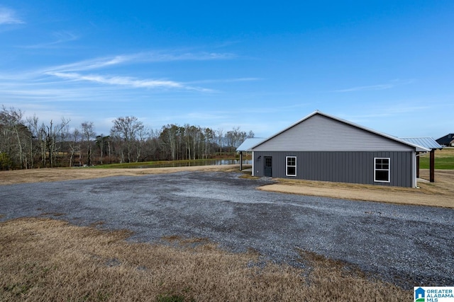 view of side of home with an outbuilding