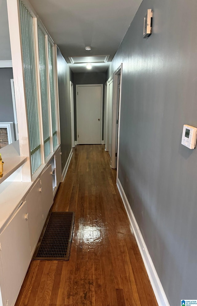 corridor with dark hardwood / wood-style floors