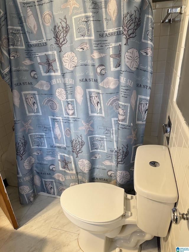 bathroom with walk in shower and toilet