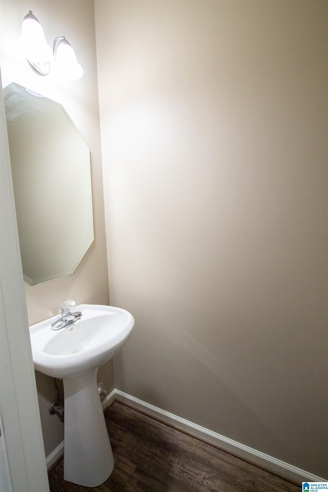 bathroom with hardwood / wood-style flooring