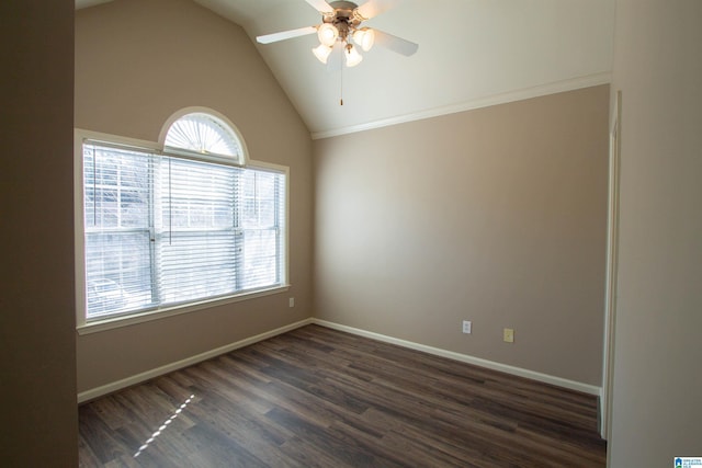 empty room with ceiling fan, dark wood-type flooring, and vaulted ceiling