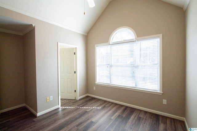 spare room featuring dark hardwood / wood-style flooring, vaulted ceiling, ceiling fan, and crown molding