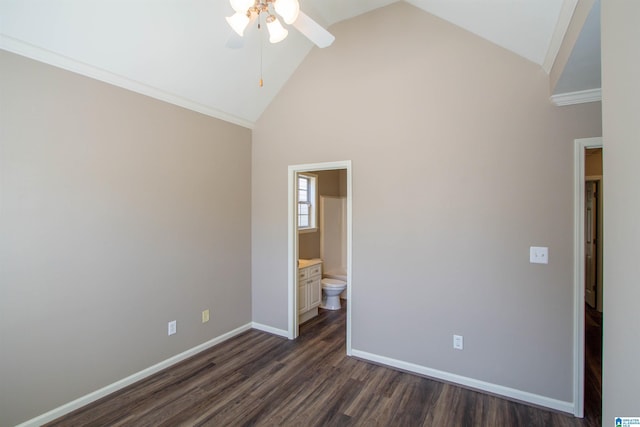 unfurnished bedroom with ensuite bath, ceiling fan, dark hardwood / wood-style flooring, and high vaulted ceiling