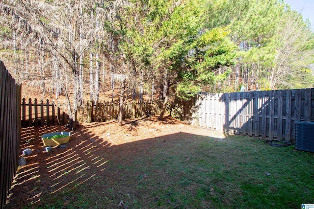 view of yard with central air condition unit