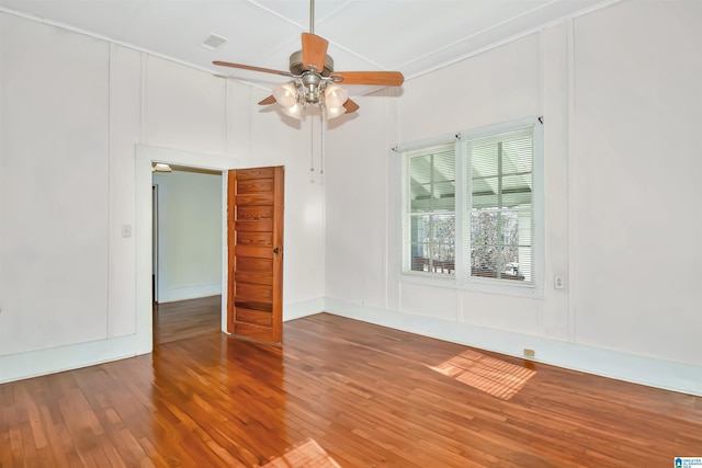 unfurnished room with ceiling fan, crown molding, and hardwood / wood-style flooring