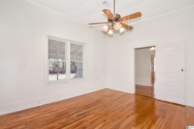 unfurnished room featuring ceiling fan and wood-type flooring