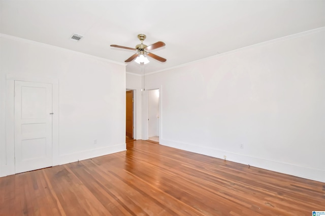 spare room featuring hardwood / wood-style flooring, ceiling fan, and ornamental molding