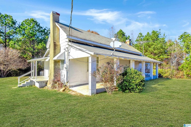 view of home's exterior with a lawn