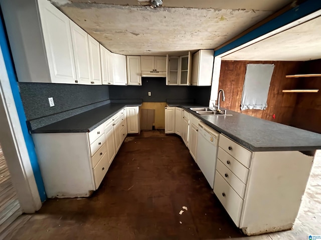 kitchen featuring kitchen peninsula, white cabinetry, dishwasher, and sink