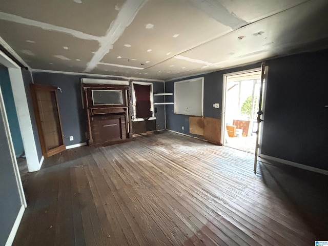 unfurnished living room featuring dark hardwood / wood-style floors