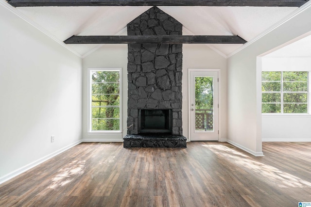 unfurnished living room featuring a fireplace, vaulted ceiling with beams, and hardwood / wood-style flooring