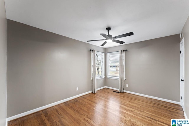 unfurnished room featuring ceiling fan and light wood-type flooring