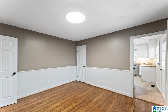 spare room featuring hardwood / wood-style flooring